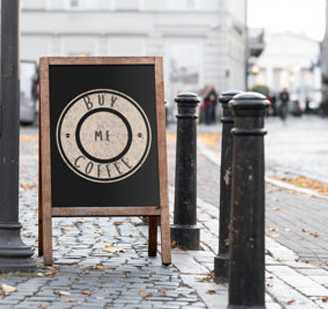 Frame Sign Placed on a Sidewalk
